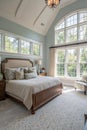 Master bedroom in suburban home with wall of windows Royalty Free Stock Photo