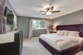 Master bedroom suite with gorgeous queen size bed Royalty Free Stock Photo