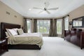 Master bedroom with wall of windows Royalty Free Stock Photo