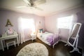 Master bedroomYoung girl`s light purple lavendar lilac walls and bed Royalty Free Stock Photo