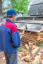 Master carpenter professionally working with an ax