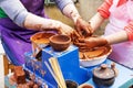 Master ceramist teaches student.Master ceramist teaches student. Craftsman hands making pottery bowl. Woman working on potter