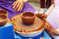 Master ceramist teaches student.Master ceramist teaches student. Craftsman hands making pottery bowl. Woman working on potter Royalty Free Stock Photo