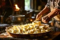 A master cheese maker makes butter in a small dairy