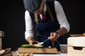 Cook preparing burger adding the sauce on green bun. Royalty Free Stock Photo