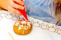 Master class with children on coloring gingerbread icing.