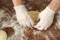 Master class on making Adjarian khachapuri at the national Georgian festival. People`s hands, dough, khachapuri, rolling pin