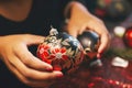 Master class on making festive Christmas trinkets: a woman makes balls