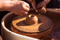 Master class in making a jug from clay, an adult teacher teaches a child to make clay products Royalty Free Stock Photo