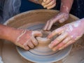 Master class on modeling of clay on a potter`s wheel In the pottery workshop for children sunny day