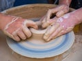 Master class on modeling of clay on a potter`s wheel In the pottery workshop for children sunny day