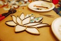 Master class of mosaic art. Closeup of mosaic in shape of lotus flower. Process of creating beautiful work