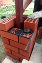 The master at the construction site is laying a brick laying Royalty Free Stock Photo