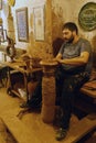 Master craftsman makes pottery on a wheel