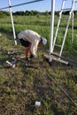 The master cuts a metal fence with an angle grinder, construction work Royalty Free Stock Photo