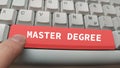 Master degree on red button of computer keyboard Royalty Free Stock Photo