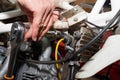 Master dismantles the motorcycle to work on the electric part of the motorcycle