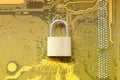 Master key or Gold Padlock on electronic motherboards background