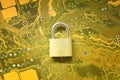 Master key or Gold Padlock on electronic motherboards background