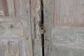 Master key lock on old wooden and decay door house