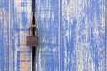 Master Key And Old Blue Wood Door For Lock .Padlocked On Blue Womaster Key And Old Blue Wood Door For Lock .Padlocked On Blue Wood