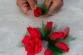 Artificial flowers from bright red paper and fabric