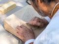 The master makes a carved wooden cutting board