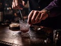 Master mixologist creating artistic cocktail