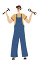 Master in overalls with a tool in his hands. Worker with a hammer and a wrench