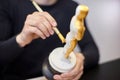 The master paints a replica of the Oscar figurine in yellow Royalty Free Stock Photo