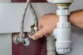 Master plumber repairs water faucets