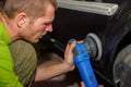 The master polishes the machine with a grinder with paste