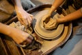 Master potter teaches the child to work on the Potter`s wheel. Close up shot