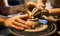 Master potter teaches the child to work on the Potter`s wheel. Close up shot