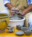 Master potter working at the potter`s wheel