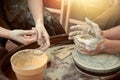 A master pottery craftsman making a small bowl