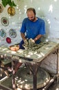 Master pottery workshop works on ancient technology on a circle with a foot drive.