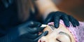 Master prepare for Microblading, micropigmentation eyebrows. woman drow on customer eyebrow white pencil, semi-permanent makeup