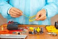 Master repairing electronic hardware in service workshop Royalty Free Stock Photo