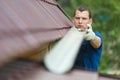 Master repairs the drain on the roof, close-up