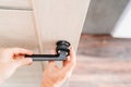 The master repairs or installs the door handle on the interior door.