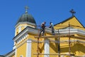 master repairs the roof of the church