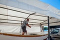 master repairs a wooden boat in Rovinj, Croatia, August 30, 2018,. Workshop for the restoration of ships on the shores