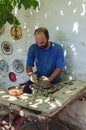 The master`s art pottery Studio when working with ancient technology on the treadle.