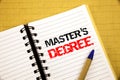 Master s Degree. Business concept for Academic Education written on notepad with copy space on old wood wooden background with pen Royalty Free Stock Photo