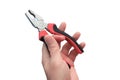Master`s hand with close-up pliers. Trade winds with insulated plastic handles