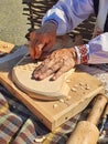 Master's hands. The artist is engaged in woodcarving