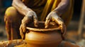 A master sculptor creating a hand made molded pottery bowl