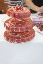 Master slicer decorating with iberian cured ham cake stand with Royalty Free Stock Photo