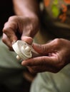 Luthier violinmaker scultping a classic violin curl